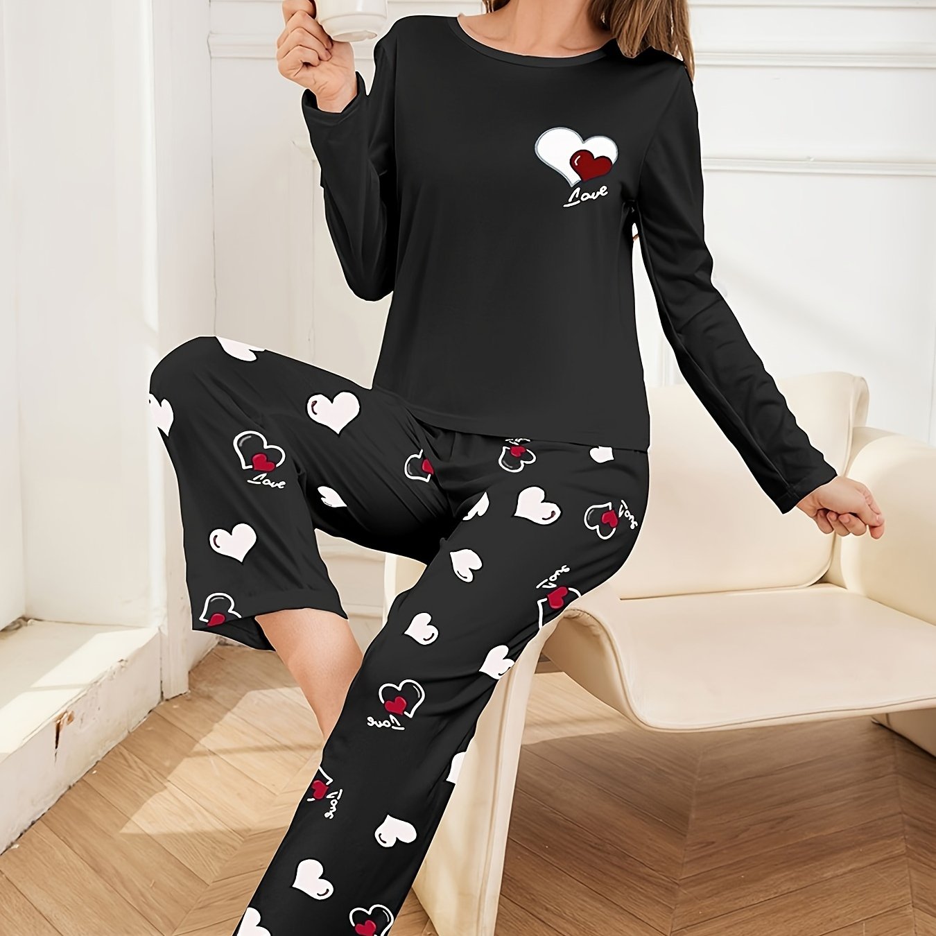 Women's pajama set for sleepwear and loungewear, featuring heart print, long sleeves, round neck top, and long pants for autumn and winter.