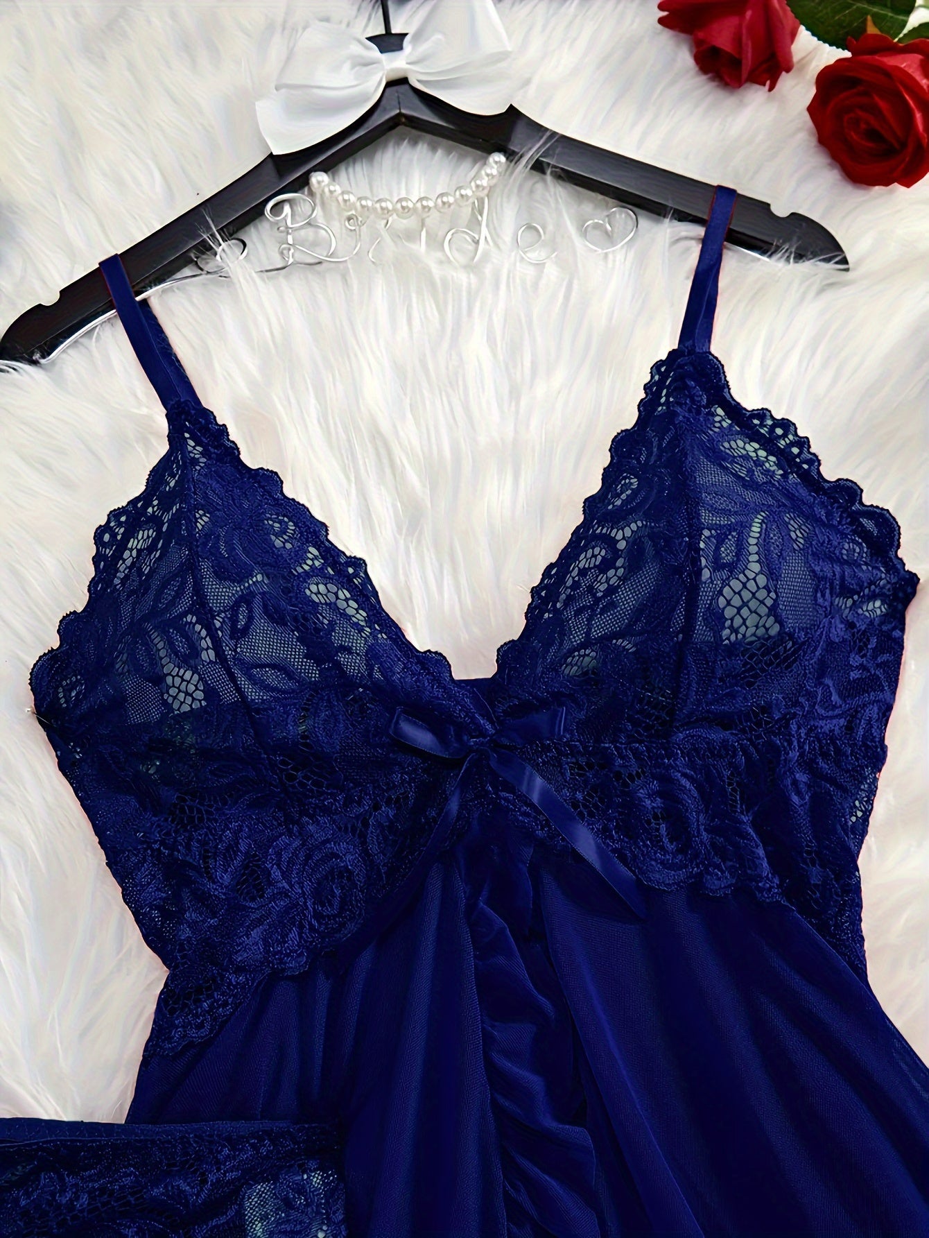 Sexy lingerie set with flower lace detail, deep V bow, pleated edge short skirt, and panties.