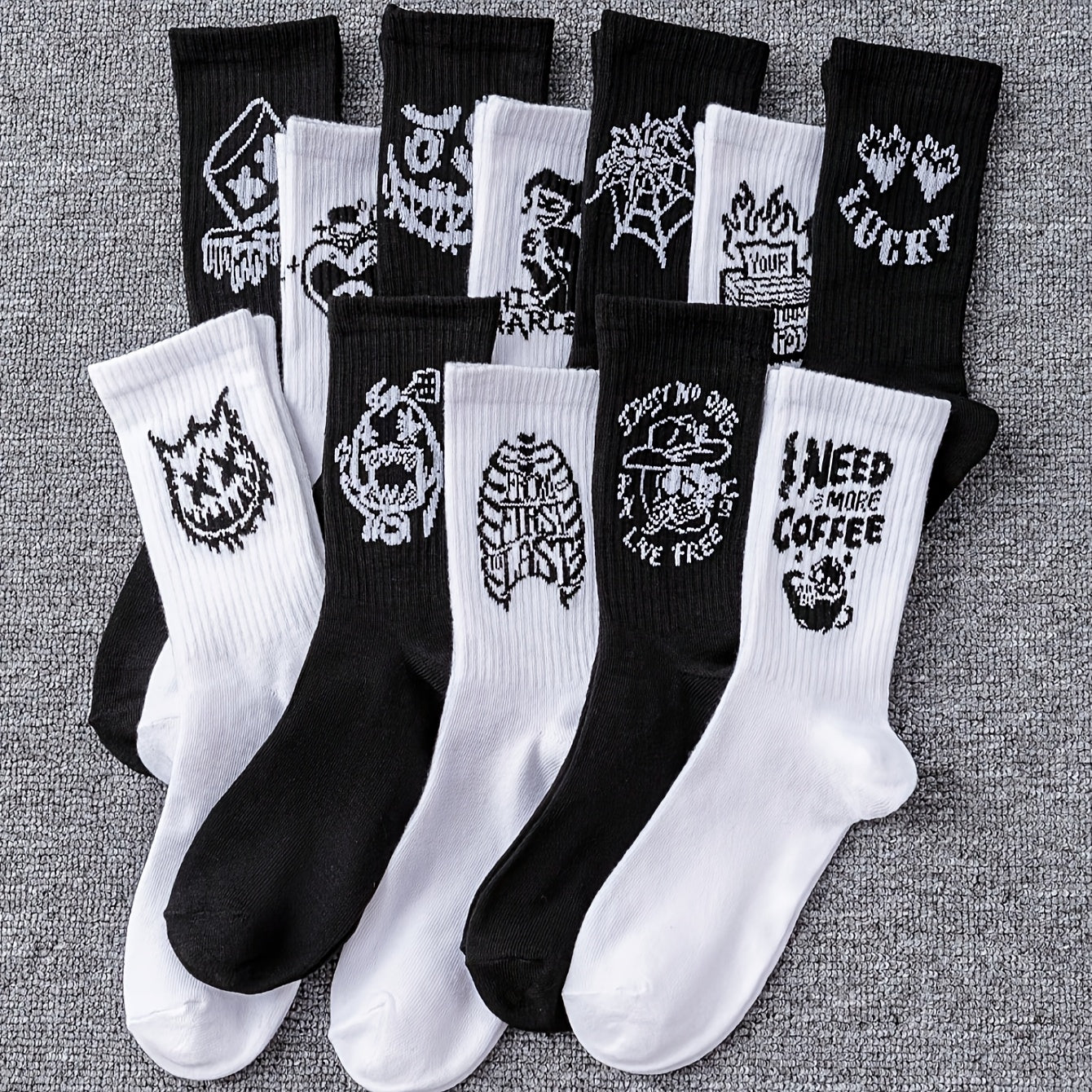 6/10 pairs of men's mid-calf socks with random black and white graffiti designs for all seasons.