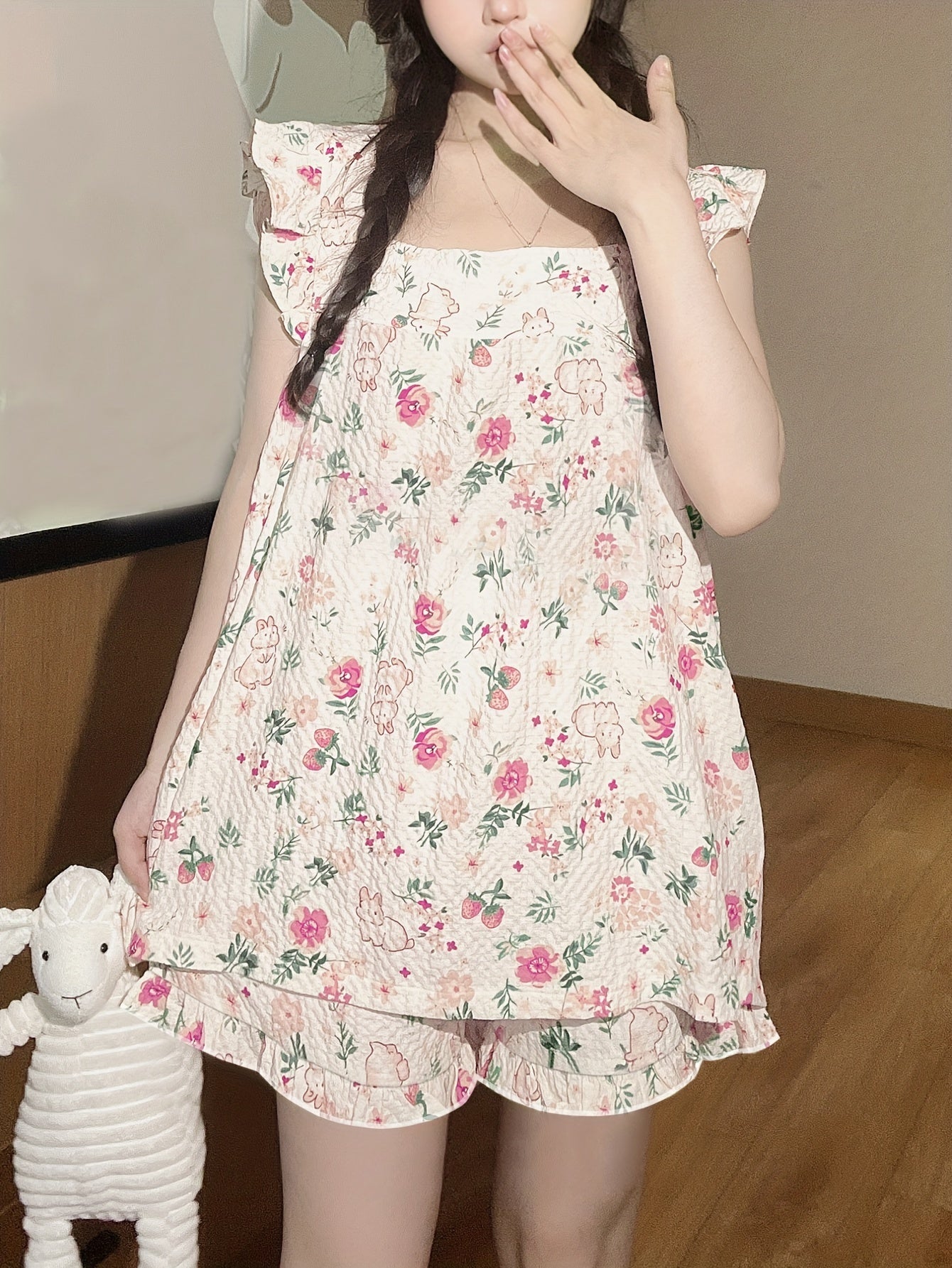 Women's loungewear set with ruffle sleeve top and elastic shorts featuring cute rabbit and floral print.