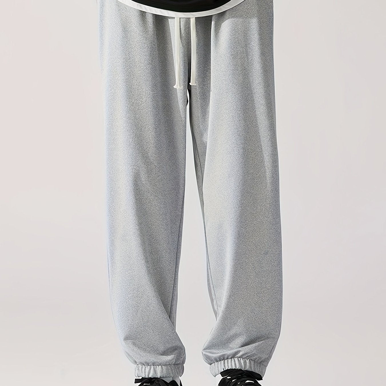 Loose fit, striped sweatpants for men, plus size, made of polyester blend with elastic waistband and drawstring. Machine washable for year-round comfort.