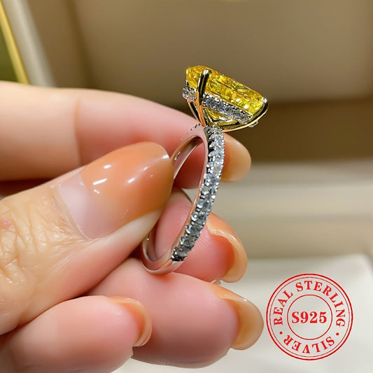 Sleek and stylish S925 sterling silver ring featuring a stunning large yellow oval-cut cubic zirconia stone. This AAA grade zirconia engagement ring is perfect for women and is gift-ready for special occasions such as banquets and Thanksgiving. Versatile