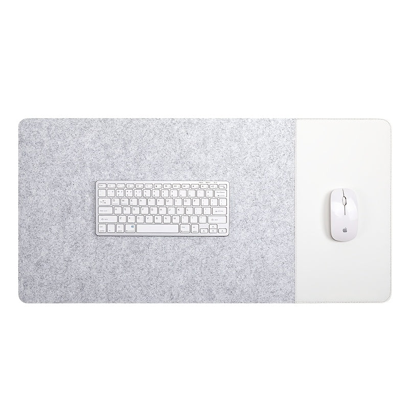 Large gaming mouse pad with anti-slip felt and faux leather, suitable for e-sports, writing, and office use. Includes wrist support and keyboard pad.