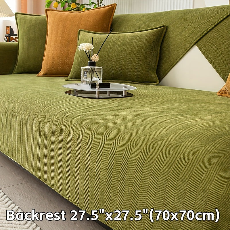 Green chenille sofa cover with herringbone pattern, non-slip and pet-friendly. Fits single to four-seater sofas. Machine washable polyester blend for sofa protection and enhancement. Ideal for living room, bedroom, or office decor.