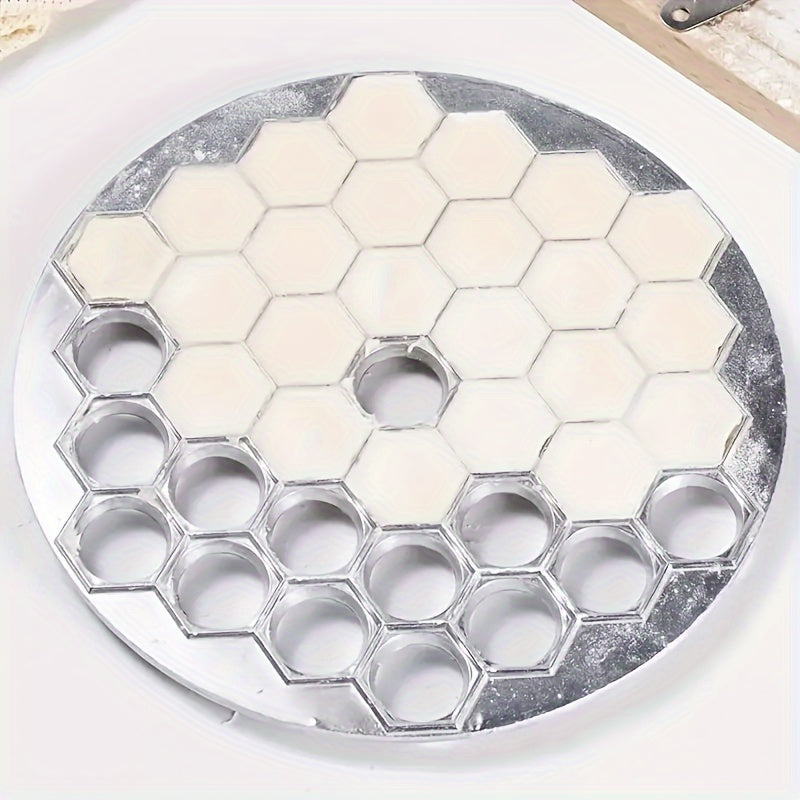 Convenient aluminum dumpling maker with 37 holes for making meat dumplings and other pastries at home. A must-have kitchen tool.