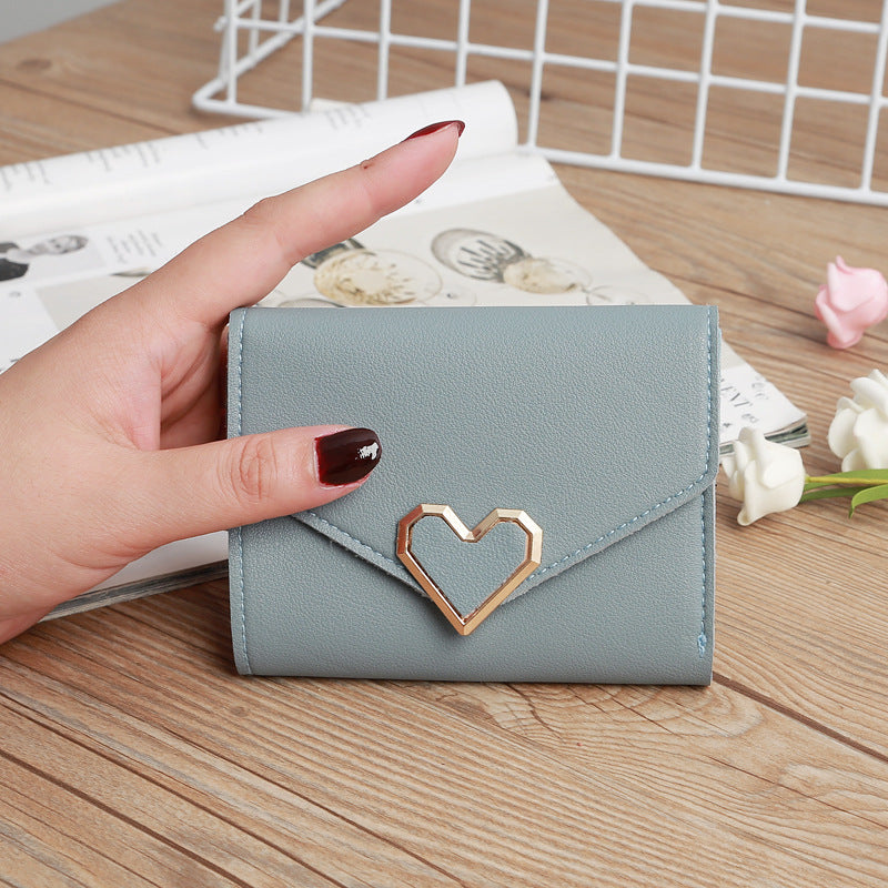 Women's mini wallet with heart-shaped design, card slots, coin pouch, faux leather