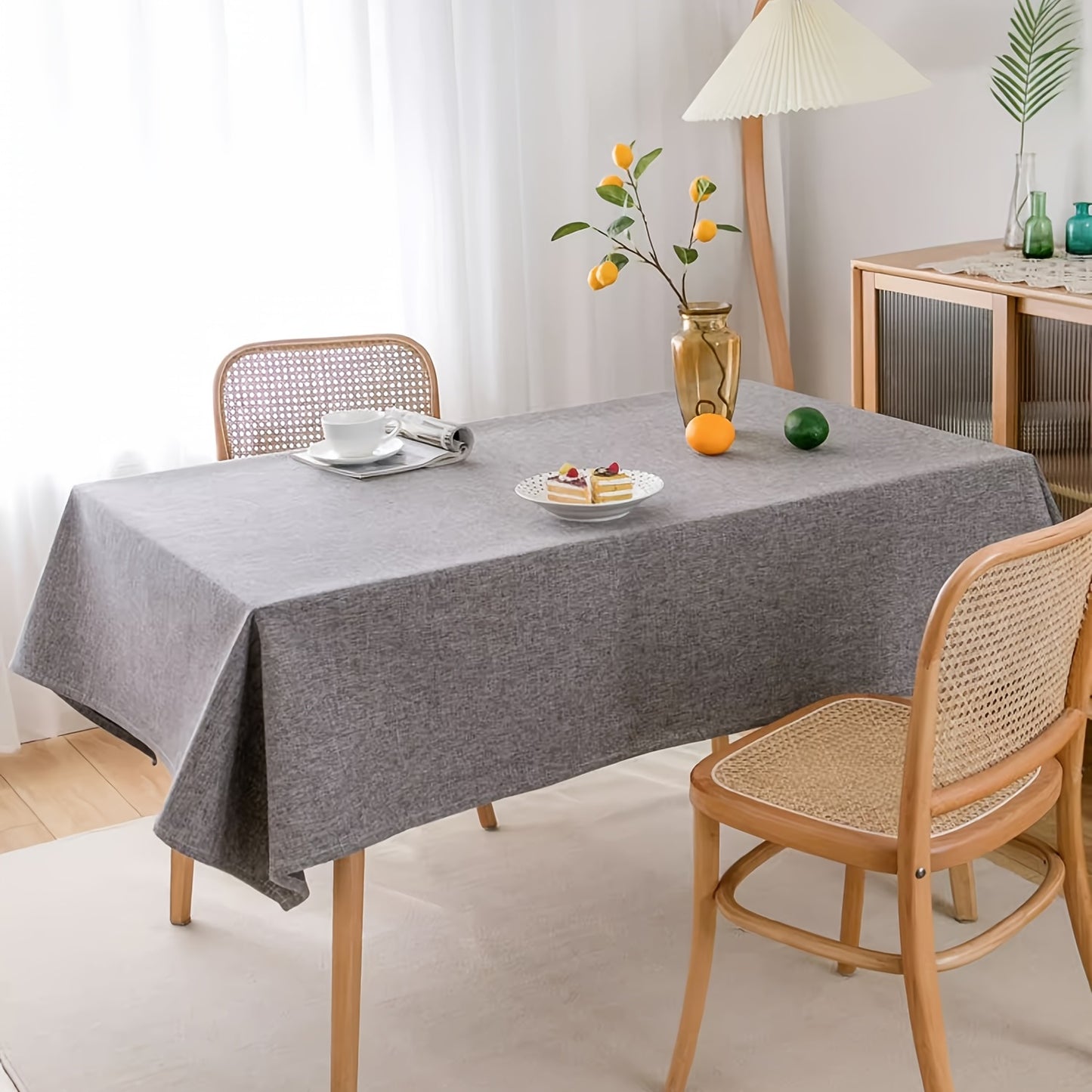 Modern grey polyester tablecloth, waterproof and thickened, machine woven, 100% polyester, for a rectangular dining table.