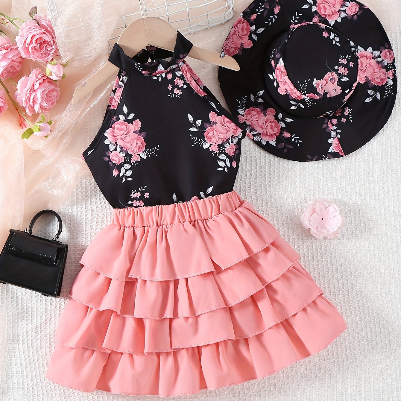 Floral garter top, layered skirt, and hat for young girls.