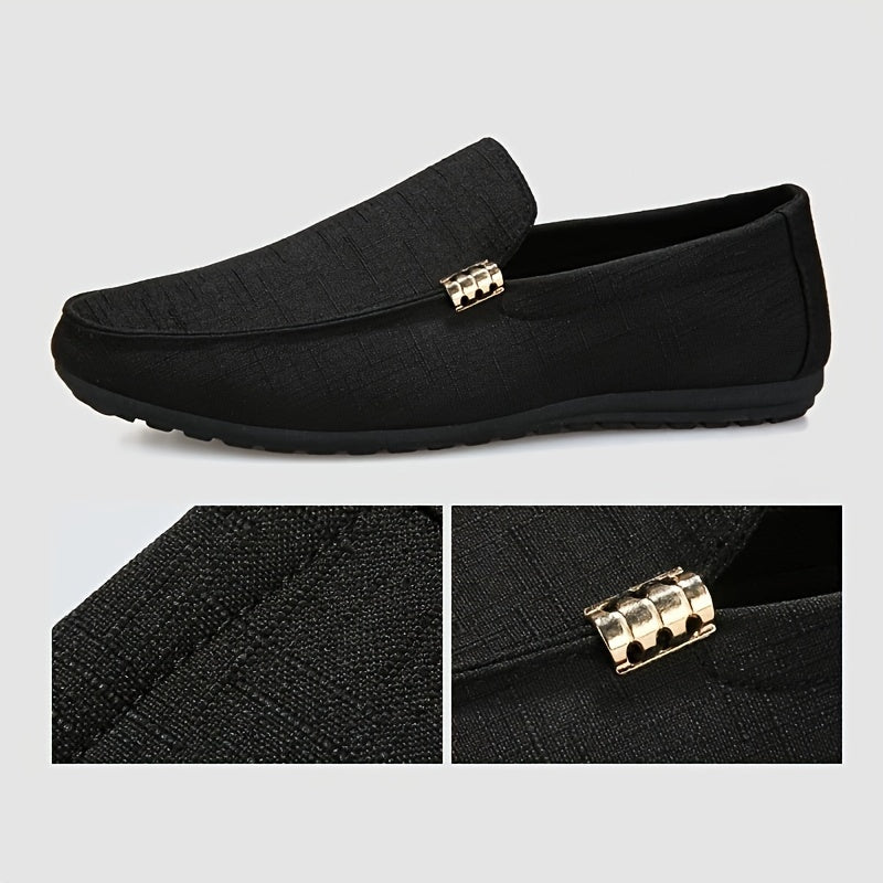 Men's black canvas loafers with metal decor, round toe, comfortable insole, suitable for casual and outdoor wear.