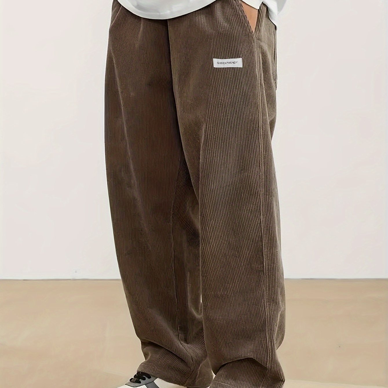 Men's casual corduroy pants with drawstring waist, ideal for outdoor activities and commuting.