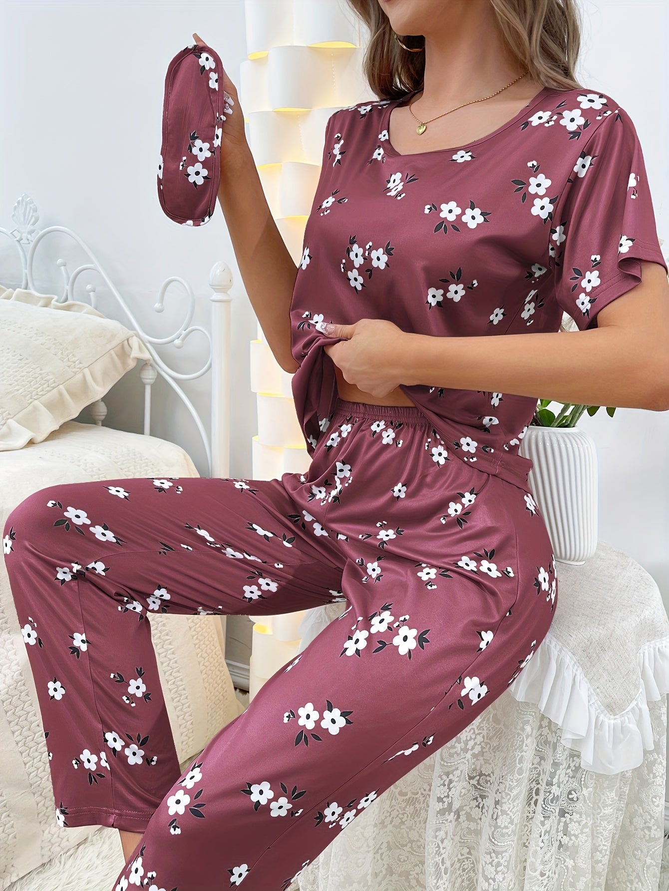 Women's sleepwear set with floral print loose pajamas, short-sleeve tee top, and pants.