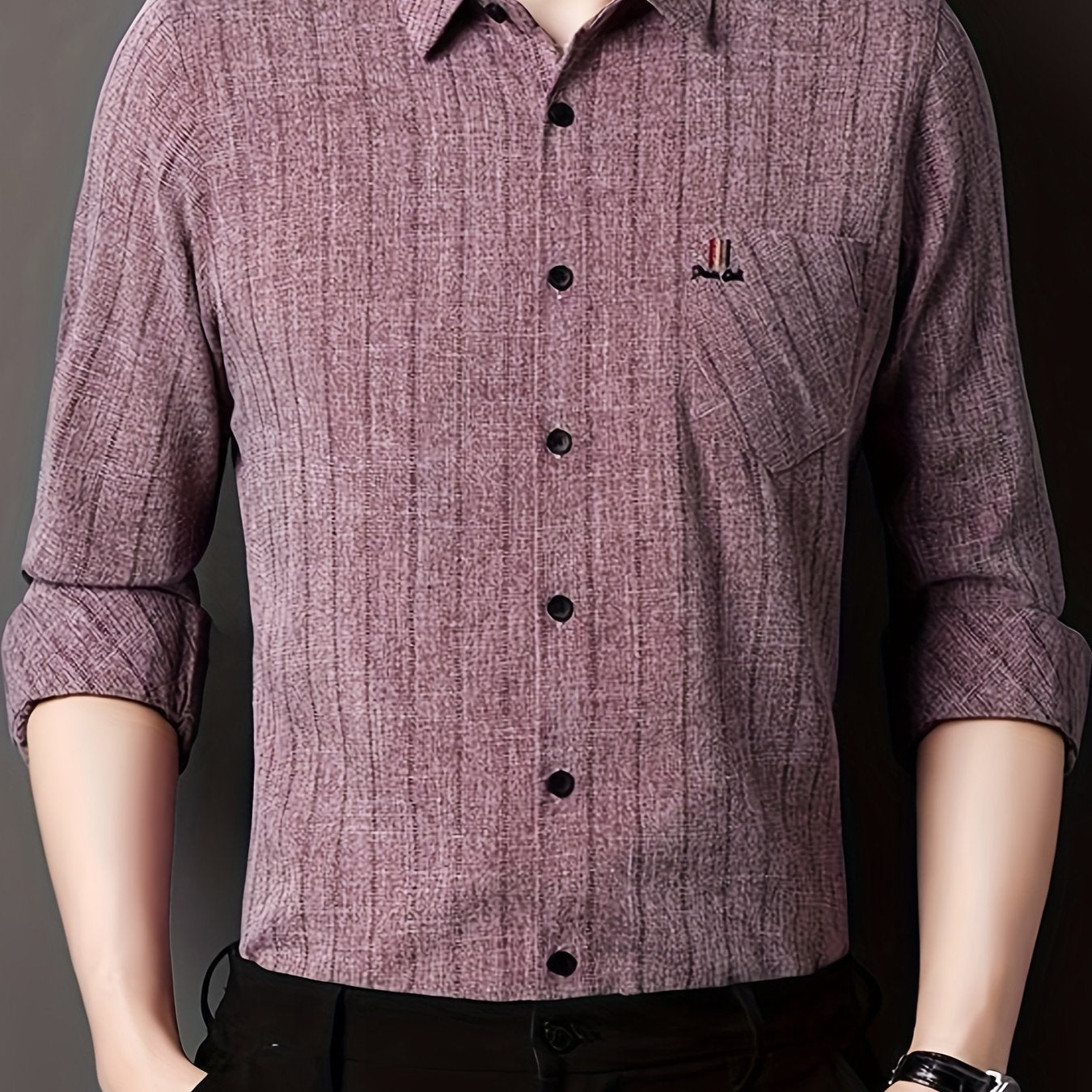 Men's striped shirt with chest pocket, collar, and long sleeves.