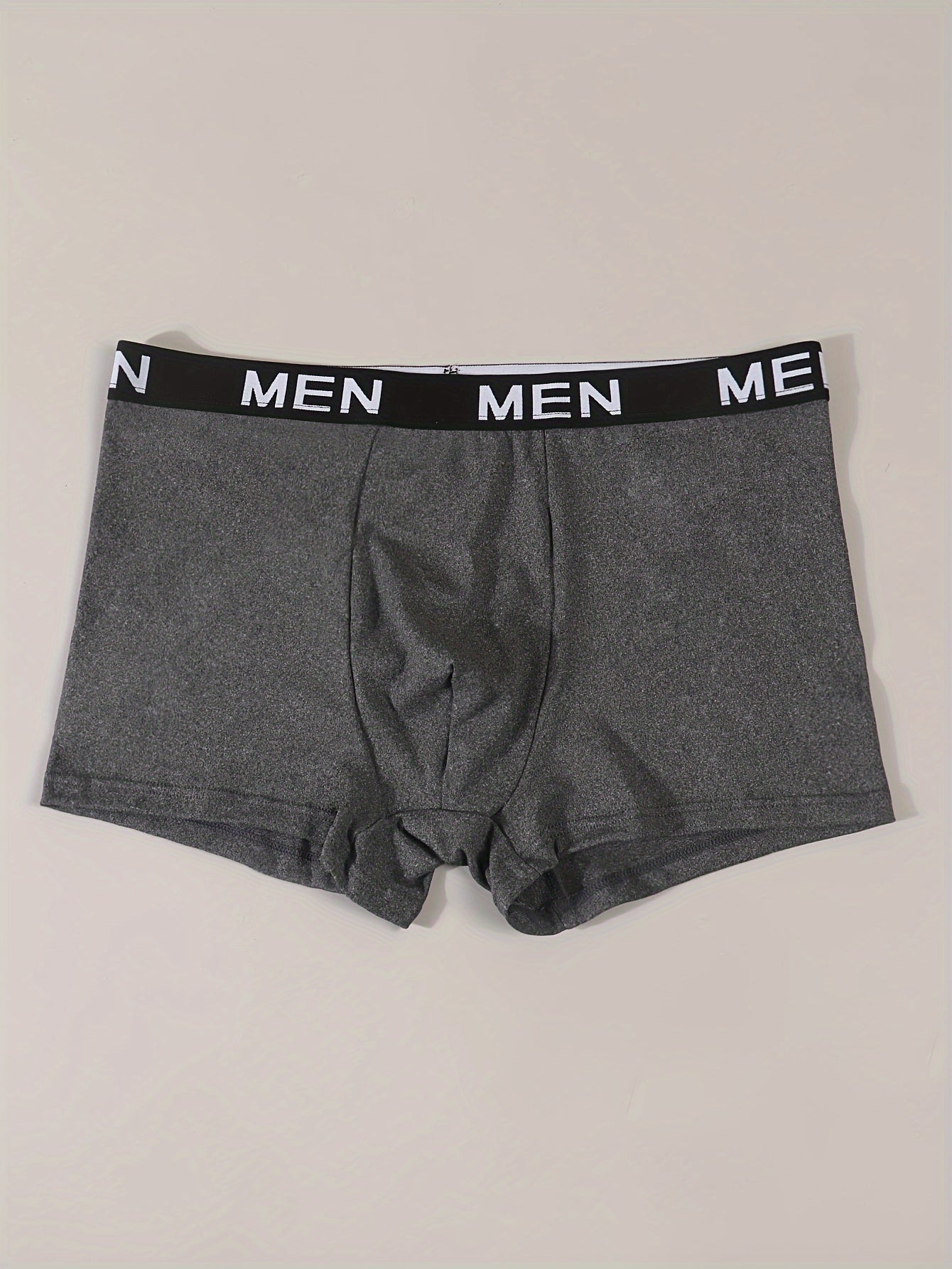 Men's printed boxer briefs made of stretchy, breathable polyester blend with elastic waistband.