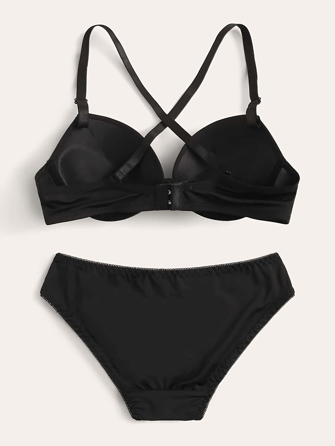 Push-up lingerie set for women, with underwire bra and high-waist panties. Nylon blend, available in black, white, and red.