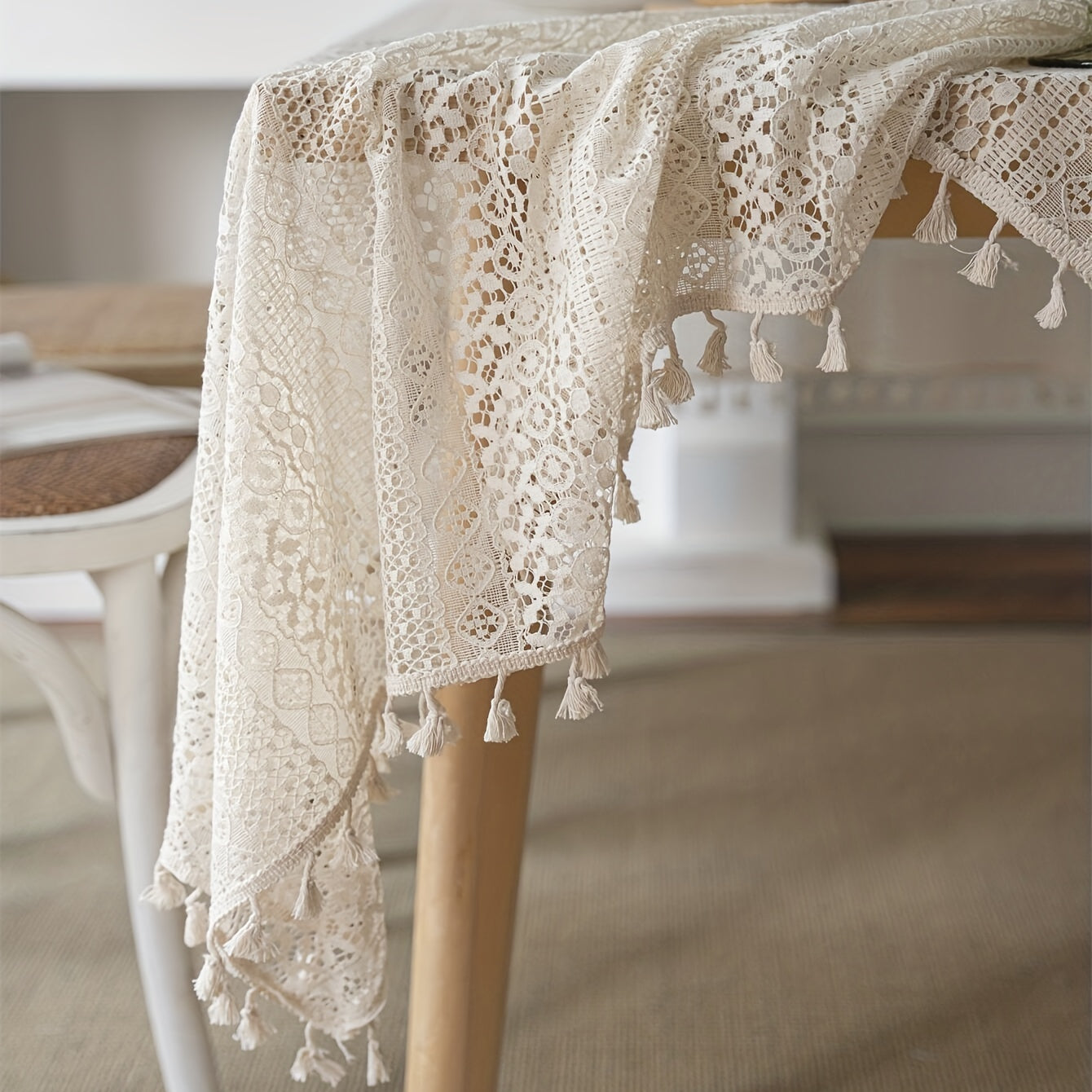 Bohemian chic crochet lace tablecloth, ideal for dining and parties. Rectangular polyester design with a farmhouse style, perfect for boho home decor. Great for buffet tables, banquets, and serving western food.