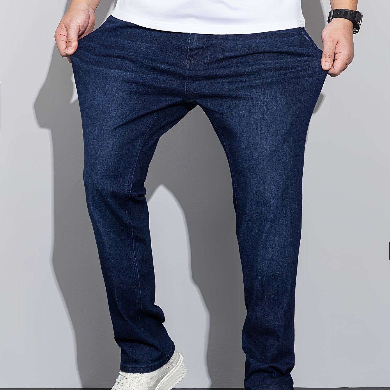 Stylish men's plus size denim pants for casual street style in spring and fall.