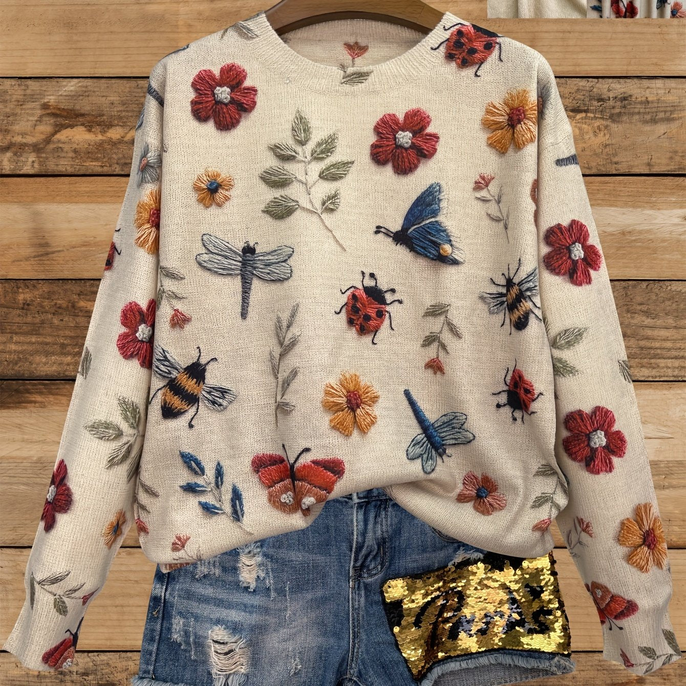 Casual lightweight women's sweater with 3D insect print, round neck, and long sleeves.