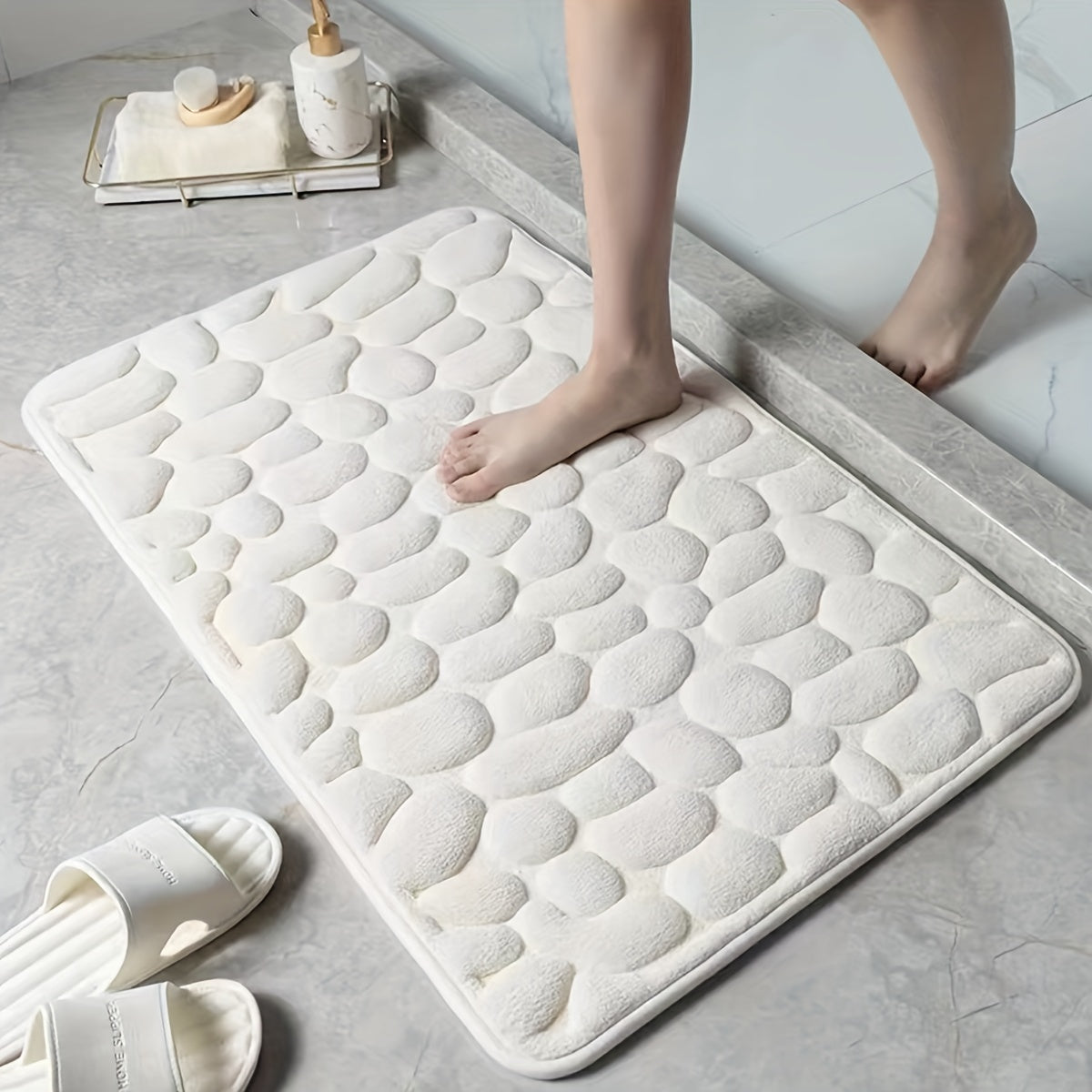 Pamper Your Feet with our Luxurious 3D Pebble Design Bath Rug! This Quick-Dry Non-Slip Bathroom Mat is made of Soft and Comfortable Polyester Memory Foam. It is Woven with a density of 700gsm and is 1.5cm Thick. Perfect for Home Decor and as Holiday