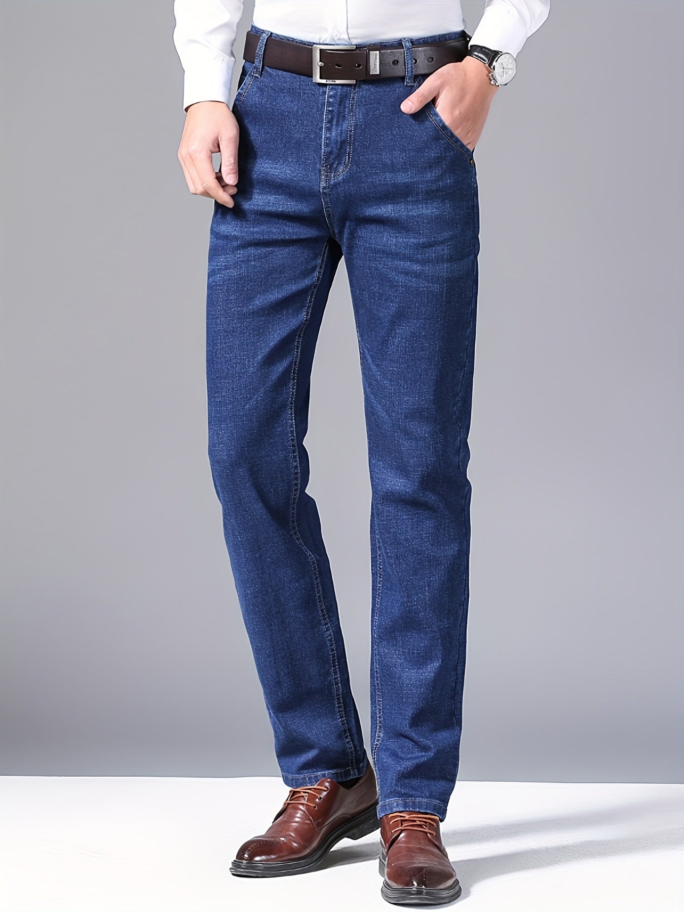 High-quality business casual denim pants for men, featuring a stretch comfort fit in a solid color washed finish. Made with all-season woven fabric of 65% cotton, 33.7% polyester, and 1.3%