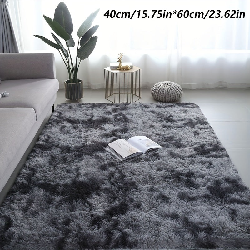 Long fleece carpet in a dark grey tie dye gradient, perfect for the living room coffee table or bedroom decor. This washable mat is fully padded and makes a great Halloween or Christmas gift.