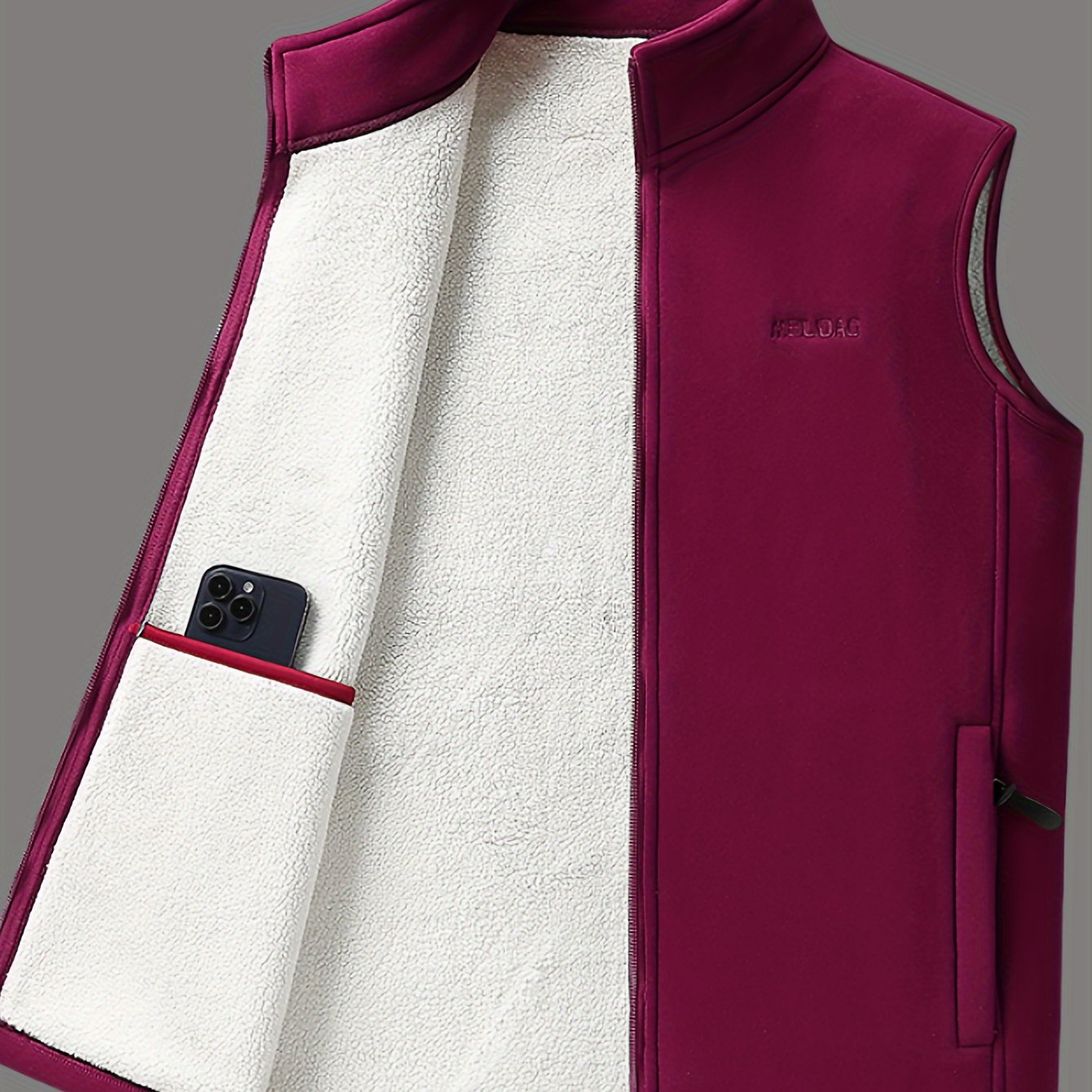 Men's cozy fleece-lined vest with stand collar, zipper pockets, and button closure for fall/winter warmth.