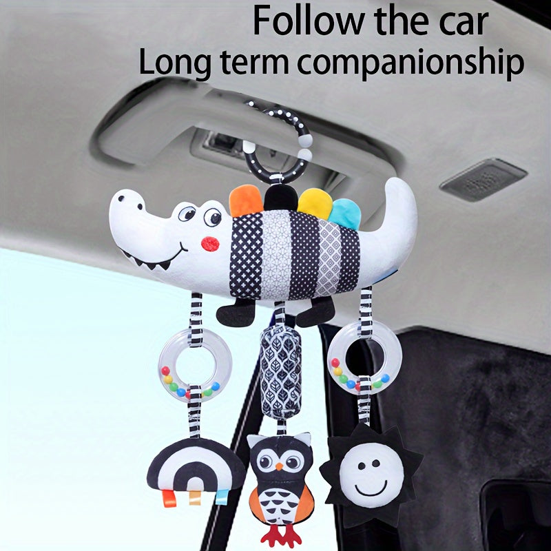 Soft and cuddly black and white animal wind chime plush toys, perfect for baby car seats and strollers. These hanging rattle toys are made of soft cloth and come from the Chinese Mainland. An ideal Christmas gift for infants aged 0-3 years old.