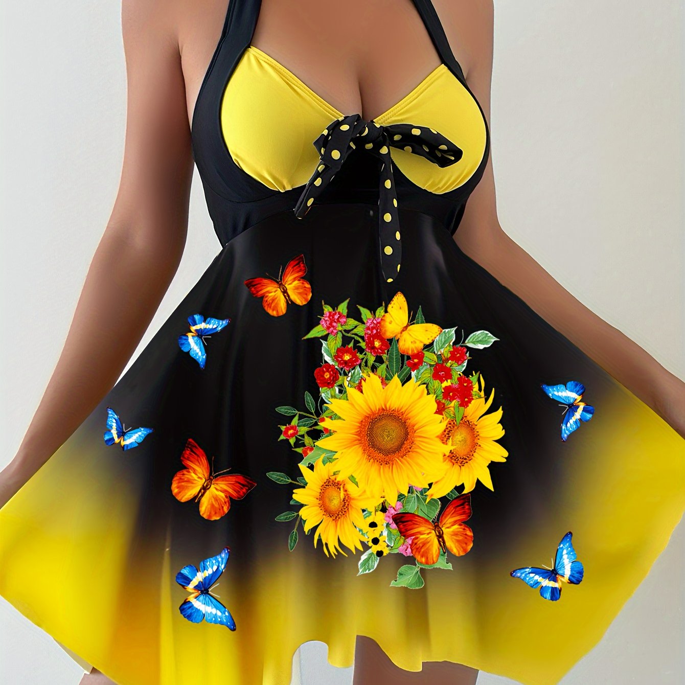 Women's 2 piece tankini set with sunflower print top, bow swim dress, and dot print bottoms.