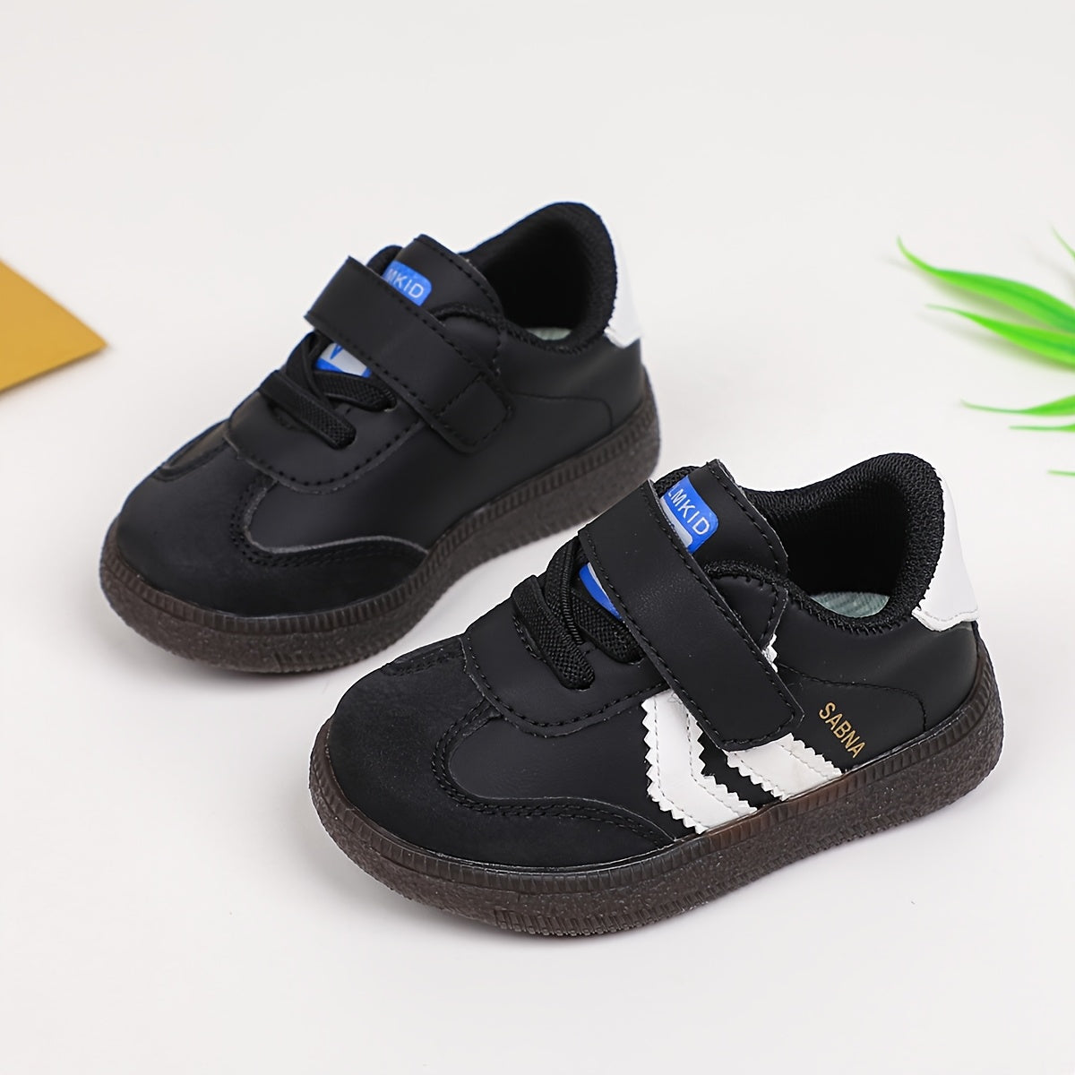 Versatile Boy's and Girl's Casual Sneakers for Spring and Summer. White and black shoes that are comfortable, lightweight, slip-resistant, and stylish for school.