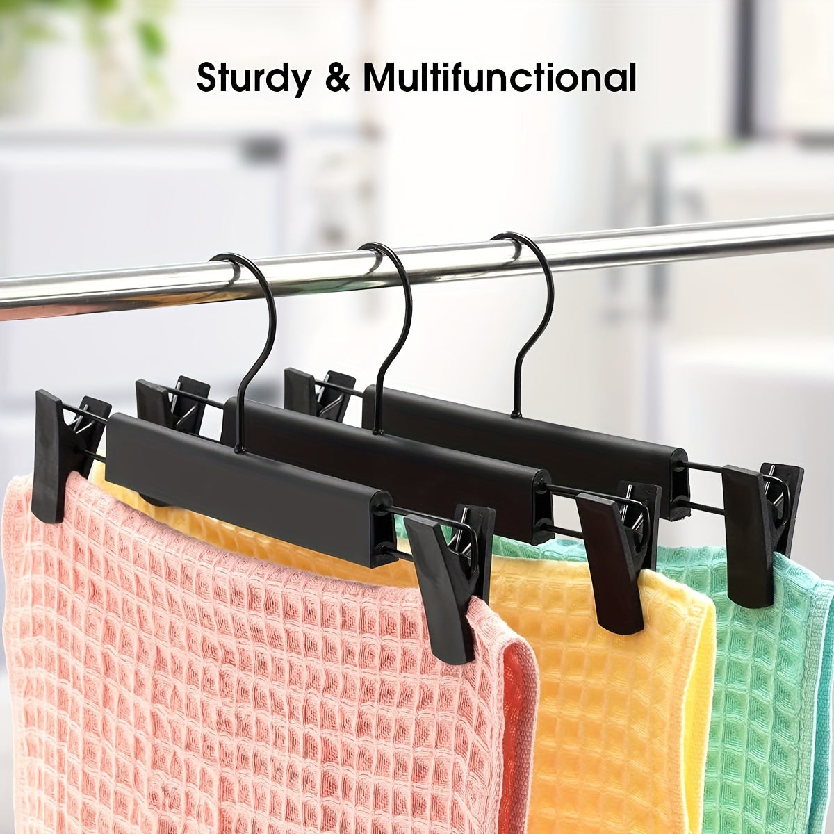 10 Adjustable Anti-Rust Clothes Hangers for Pants, Skirts, and Tops - Black Plastic Material