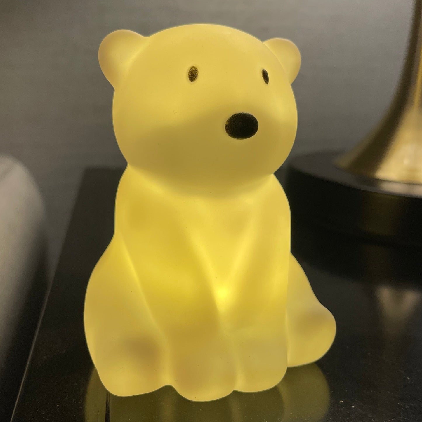 Get your hands on this adorable Cartoon Polar Bear Night Light! This energy-efficient LED lamp is rust-resistant and comes with a convenient toggle switch. Perfect for adding a touch of whimsy to your bedroom or living room decor, this plastic countertop