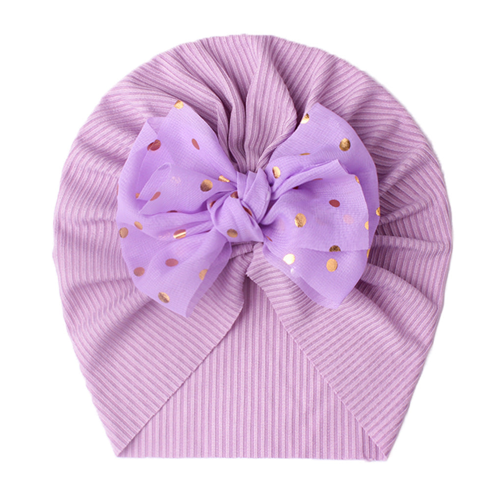 Polka dot printed bow head wrap for newborn infants and toddlers.