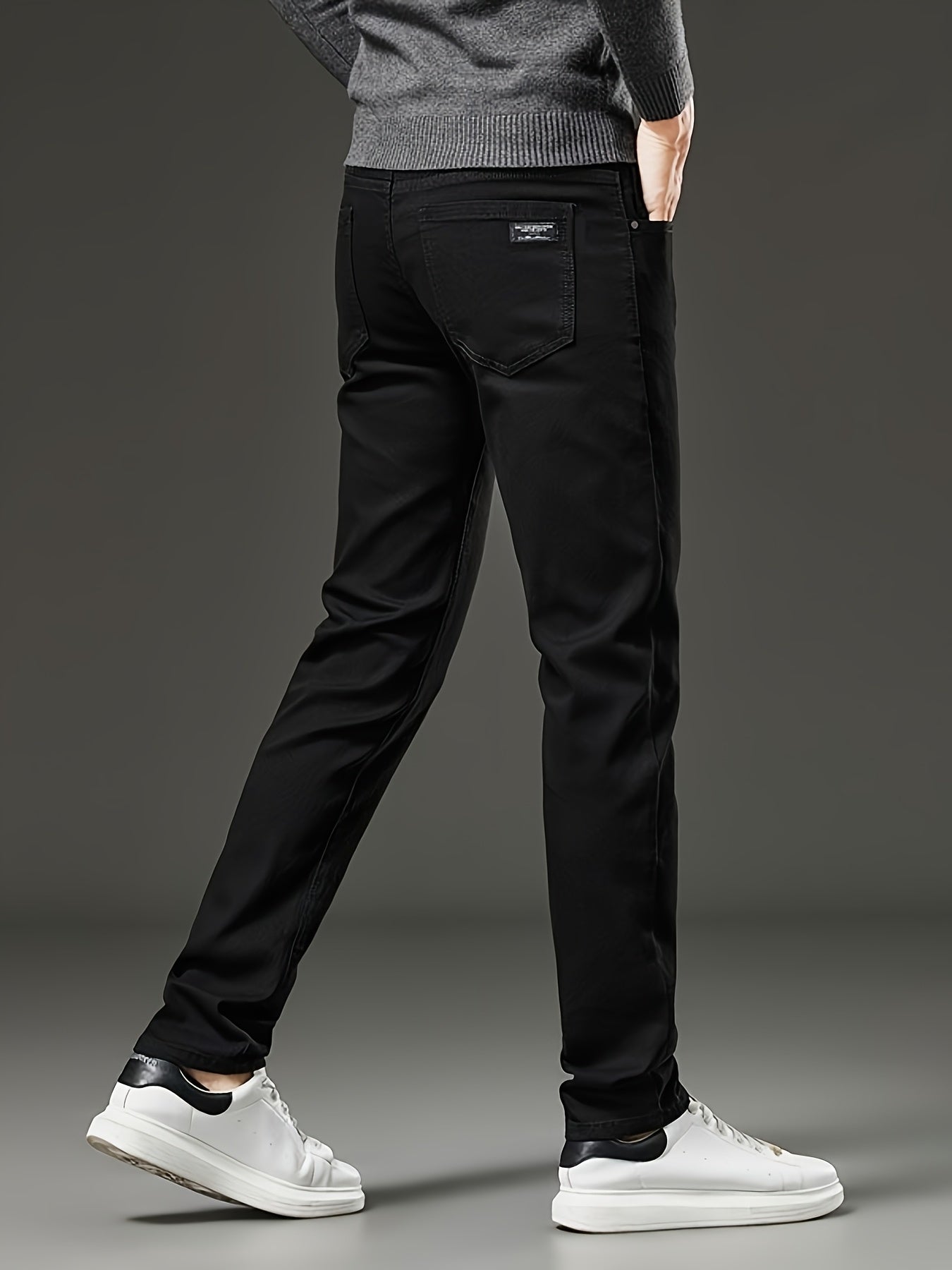 Slim fit men's jeans made of stretch denim in a solid color with washed details, suitable for year-round wear.