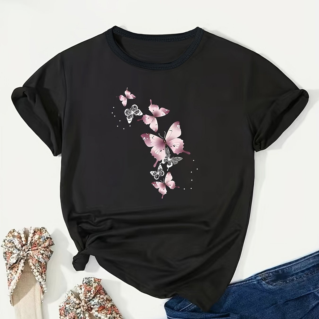 Stylish plus size pink butterfly print t-shirt for women, crew neck, short sleeve, stretchy polyester blend, machine washable. Ideal for spring/summer.