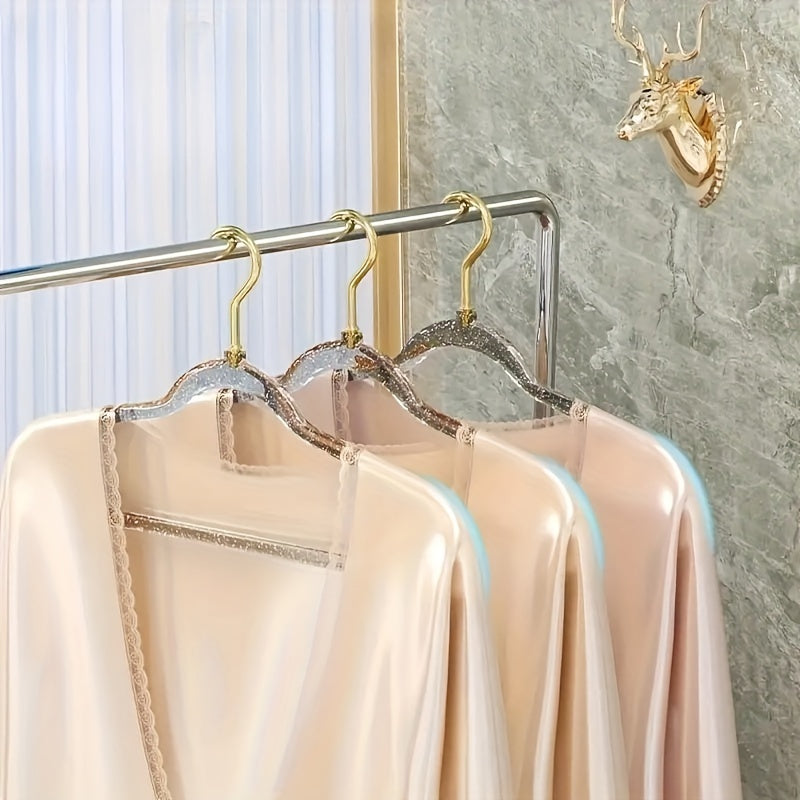 A set of 12 premium acrylic hangers with a non-slip, sparkling transparent design, providing a firm grip for wardrobe storage. These durable, thick hangers are perfect for bedroom closets, offering a traceless hanging solution.