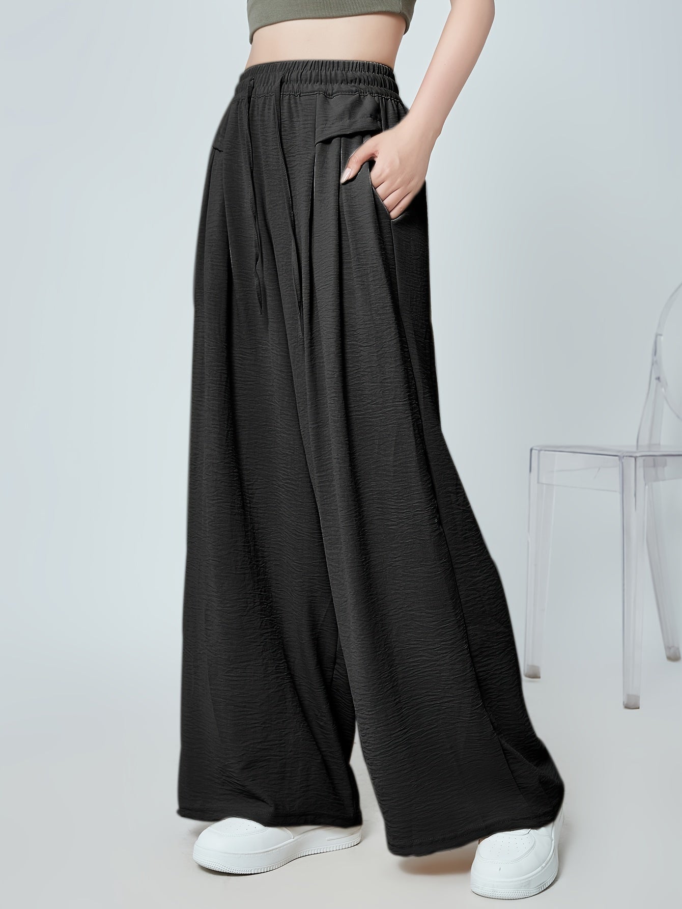 Stylish lounge bottoms with elastic drawstring, pleated detail, and wide leg fit for women's loungewear.