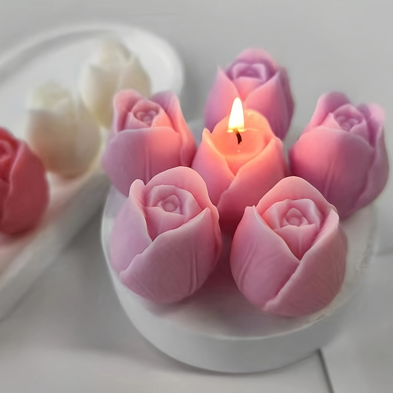 Pink tulip-shaped silicone mold for DIY candle and resin crafts, with flexible, irregular flower design for decorative ornaments.