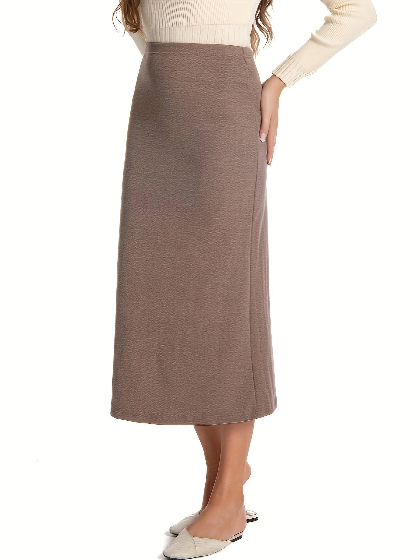 Women's warm fleece-lined skirt with elastic waistband, in solid black, ideal for autumn and winter.