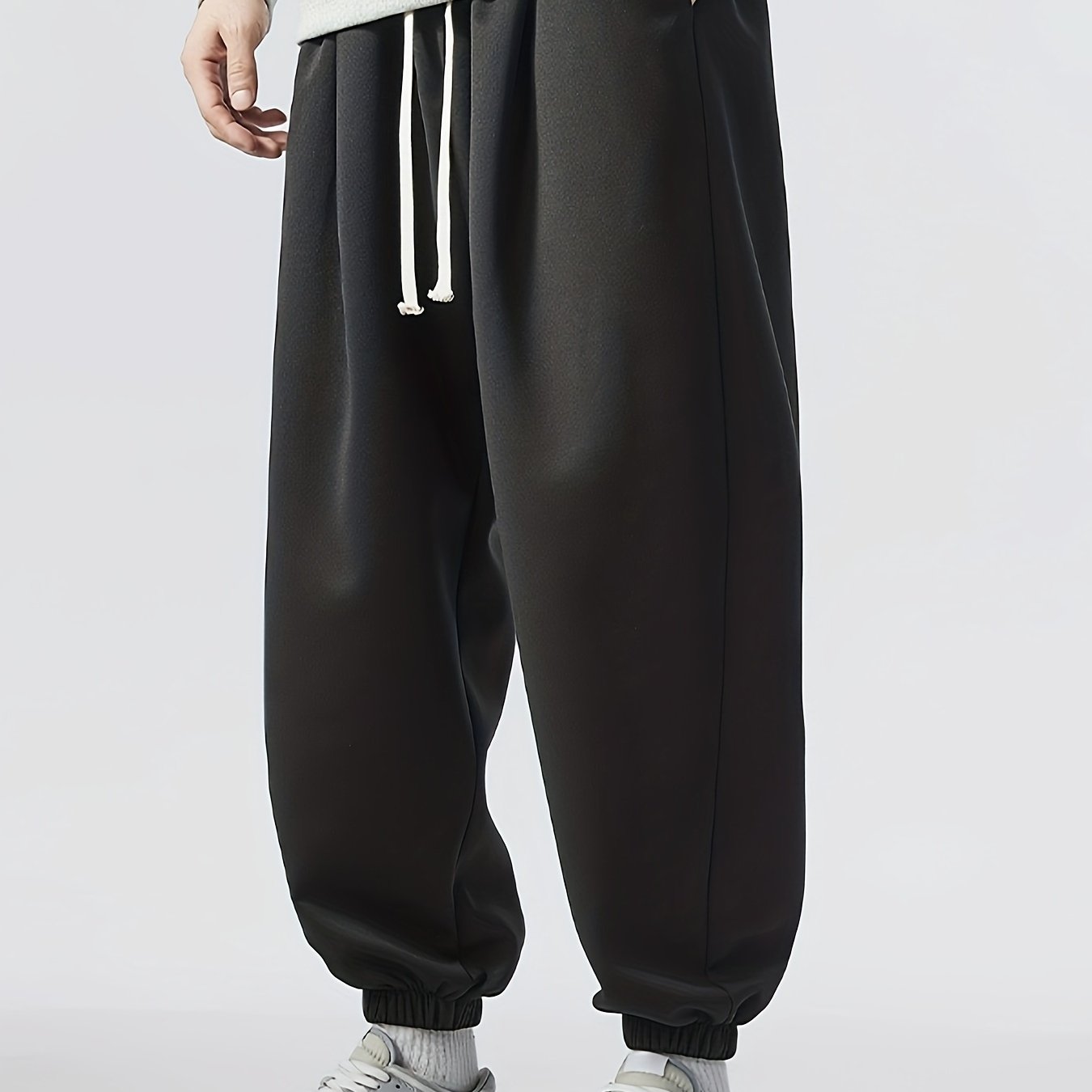 Loose fit, striped sweatpants for men, plus size, made of polyester blend with elastic waistband and drawstring. Machine washable for year-round comfort.