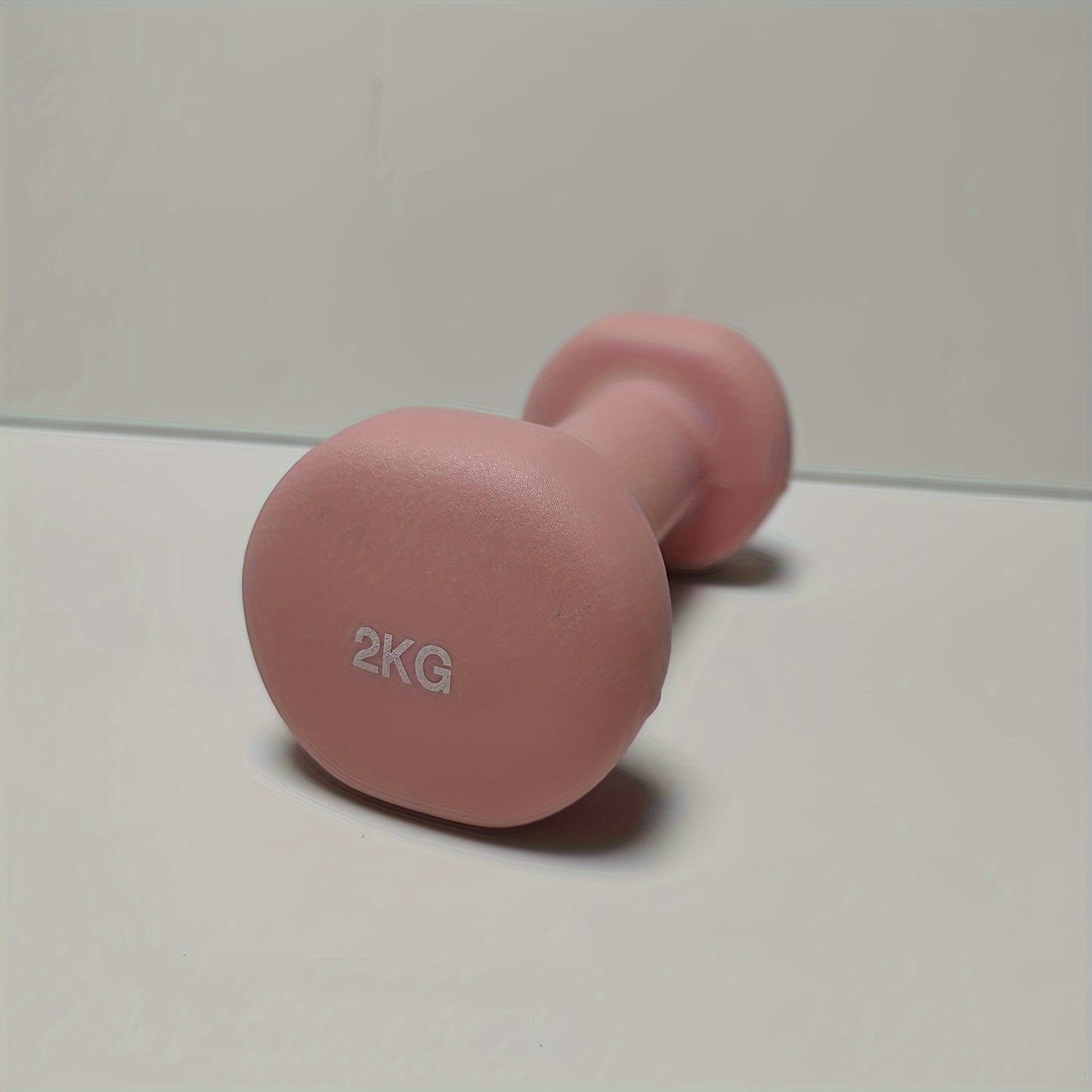 1pc 2kg dumbbell in pink/blue/black colors, made of solid cast iron for home gym. Durable and stylish fitness accessory for both men and women.