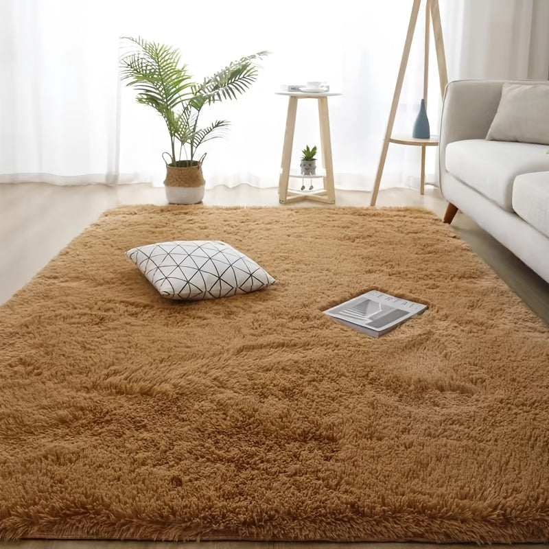 Luxurious soft plush faux fur area rug with anti-slip knitted polyester backing. This machine-made thick, warm, and fluffy mat is perfect for bedroom and living room use. It is hand washable and stain-resistant, making it easy to care for and