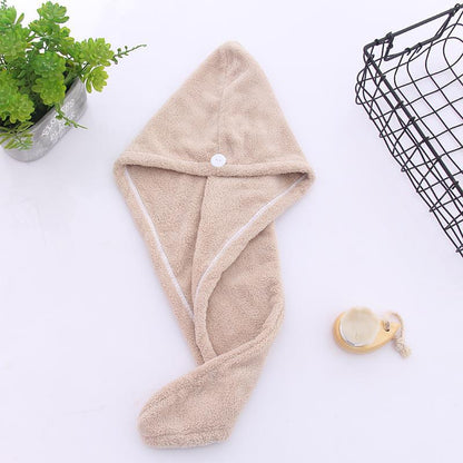 Super absorbent hair towel made of soft and water-absorbing microfiber with anti-frizz and anti-static features, perfect for bathroom use. Made of 100% polyester.