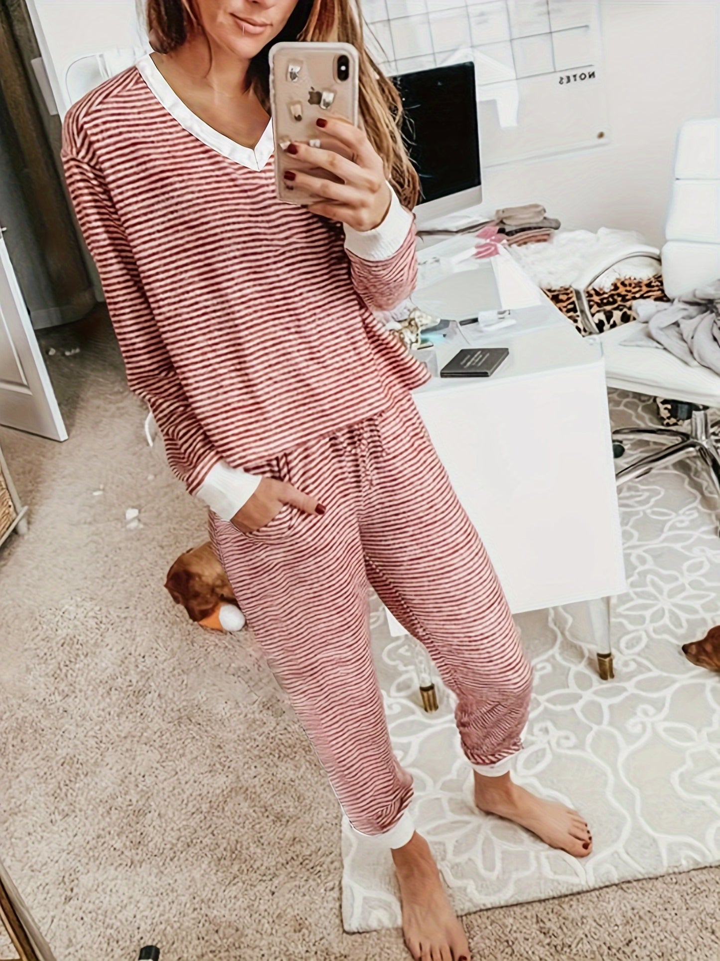 Casual knit pajama set with V-neck, striped design, and drawstring. Made of 95% polyester and 5% elastane for fall/winter home wear. Includes long sleeve top and matching lounge pants.