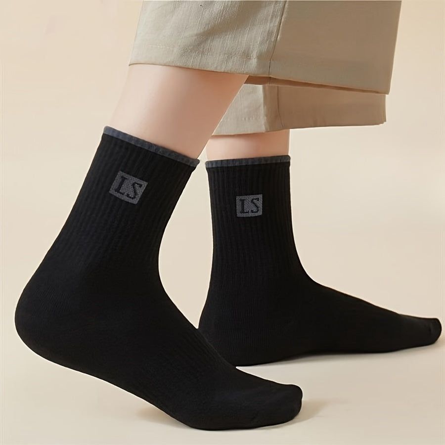 5 pairs of men's trendy solid crew socks, breathable and comfy for outdoor and all-season wear.