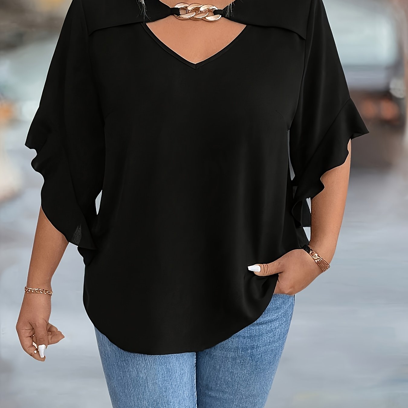 Stylish black V-neck tops for plus-size women in new summer collection.