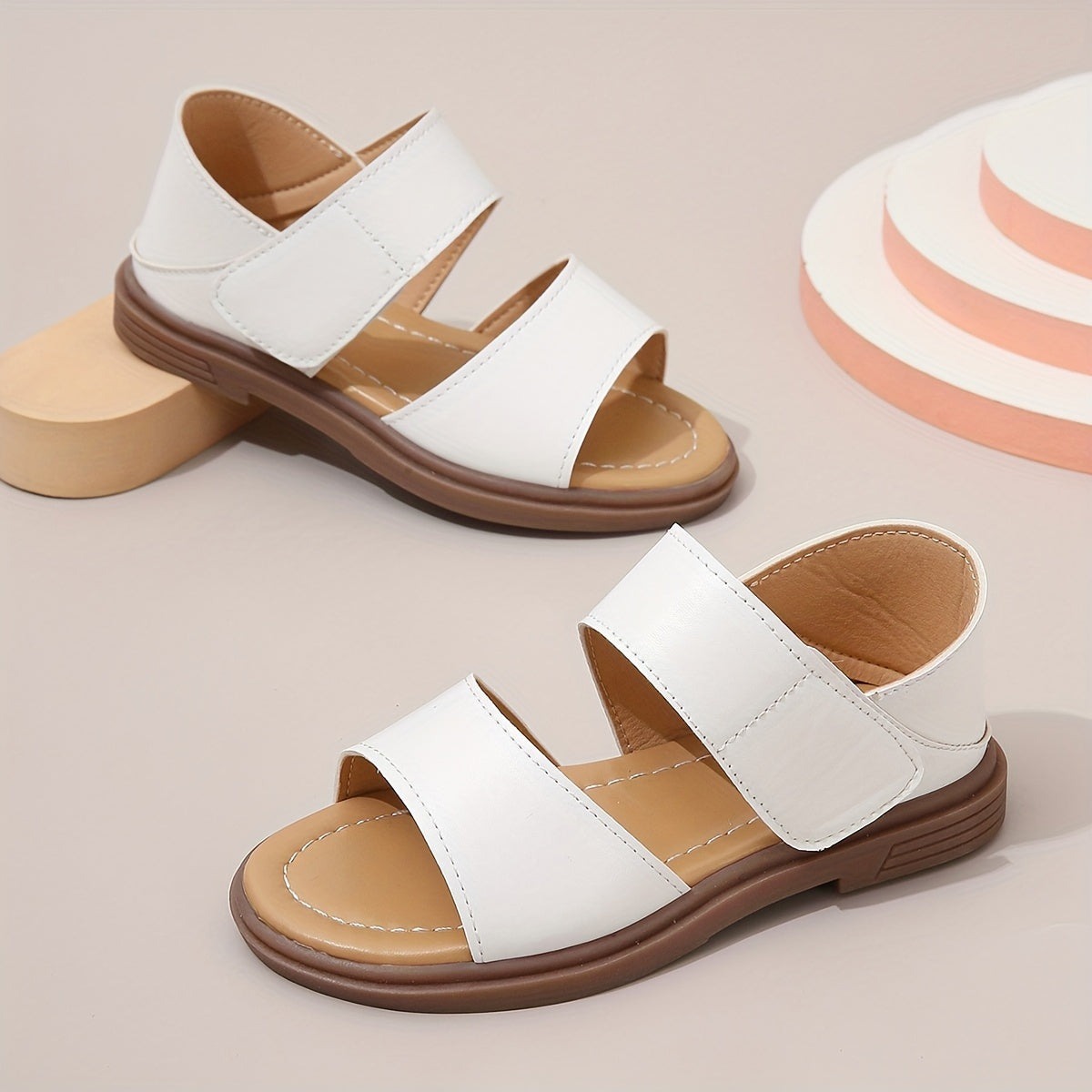 Stylish summer sandals for girls: open-toe design with braided straps and flat sole, ideal for casual wear and festivals.