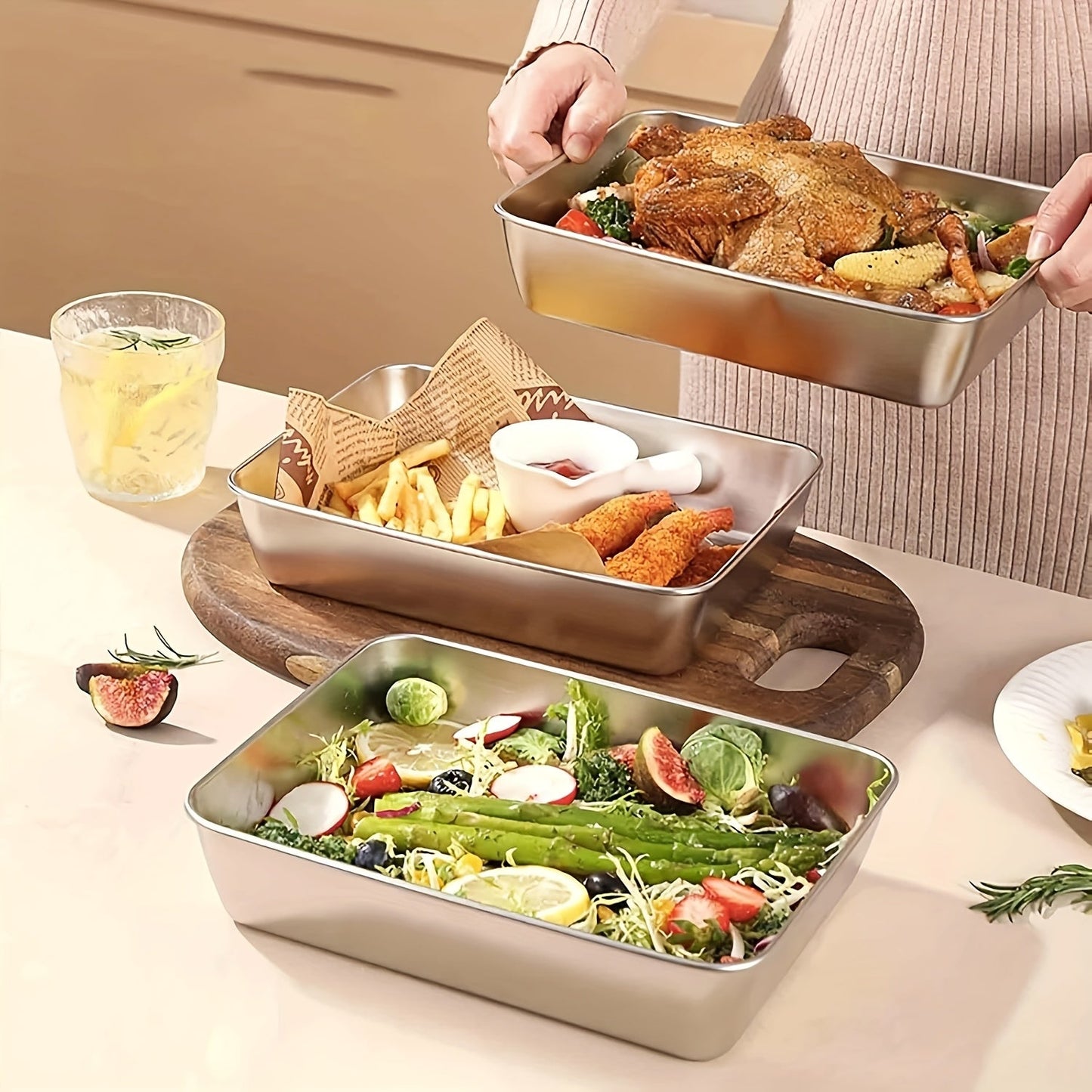 One or two pieces of a household kitchen baking pan made of thickened stainless steel, complete with a lid.