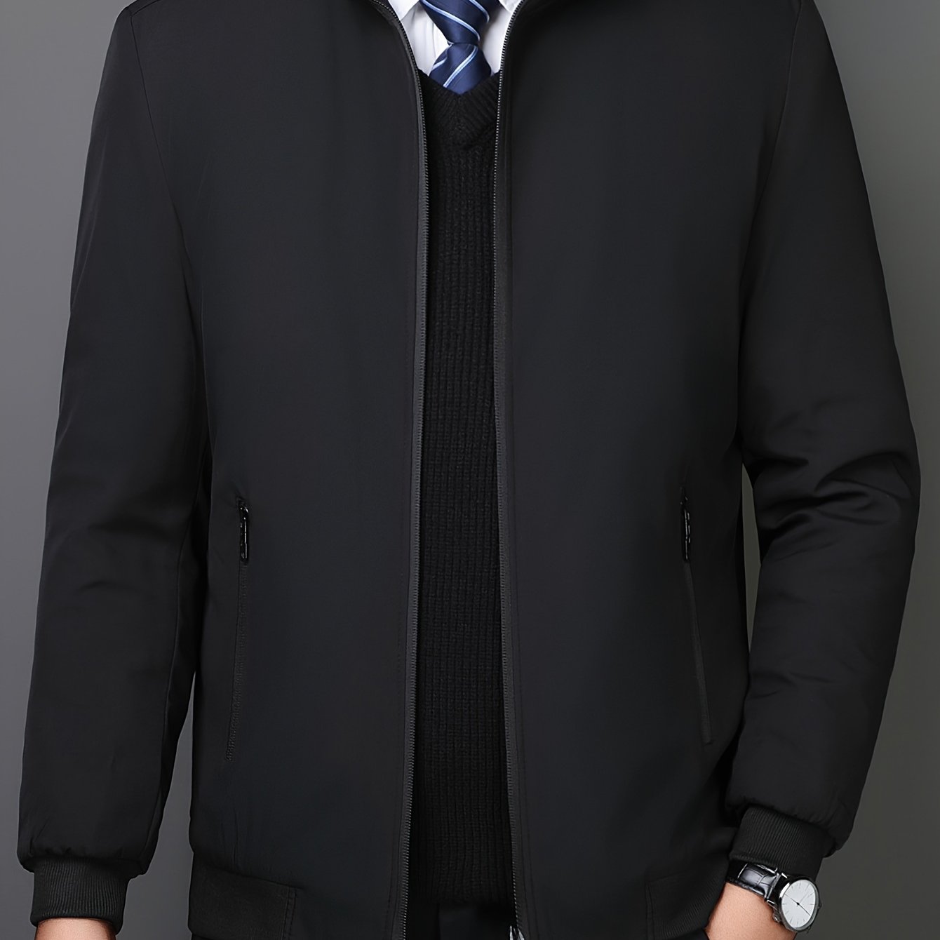 Casual men's stand collar varsity jacket with zipper pockets.