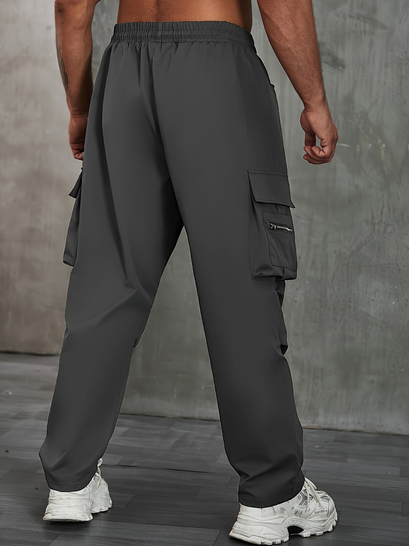 Men's solid cargo pants in plus sizes for spring and fall outdoor sports.