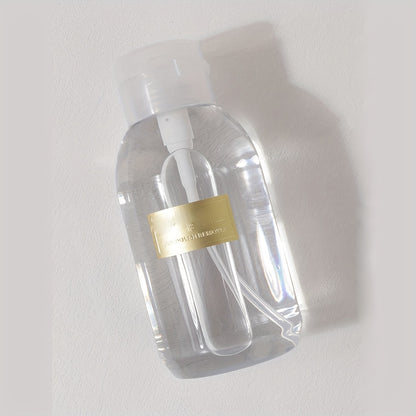 A portable push down empty bottle for dispensing nail polish or makeup remover.