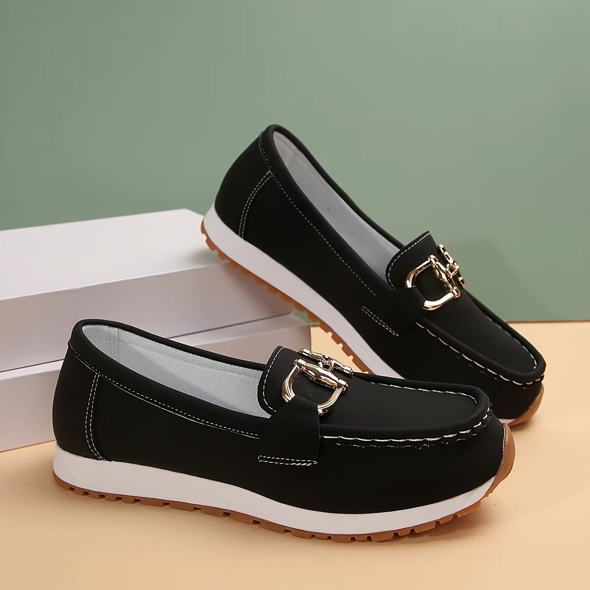 Solid color loafers for women with metallic buckle, soft sole, and closed toe for casual wear.